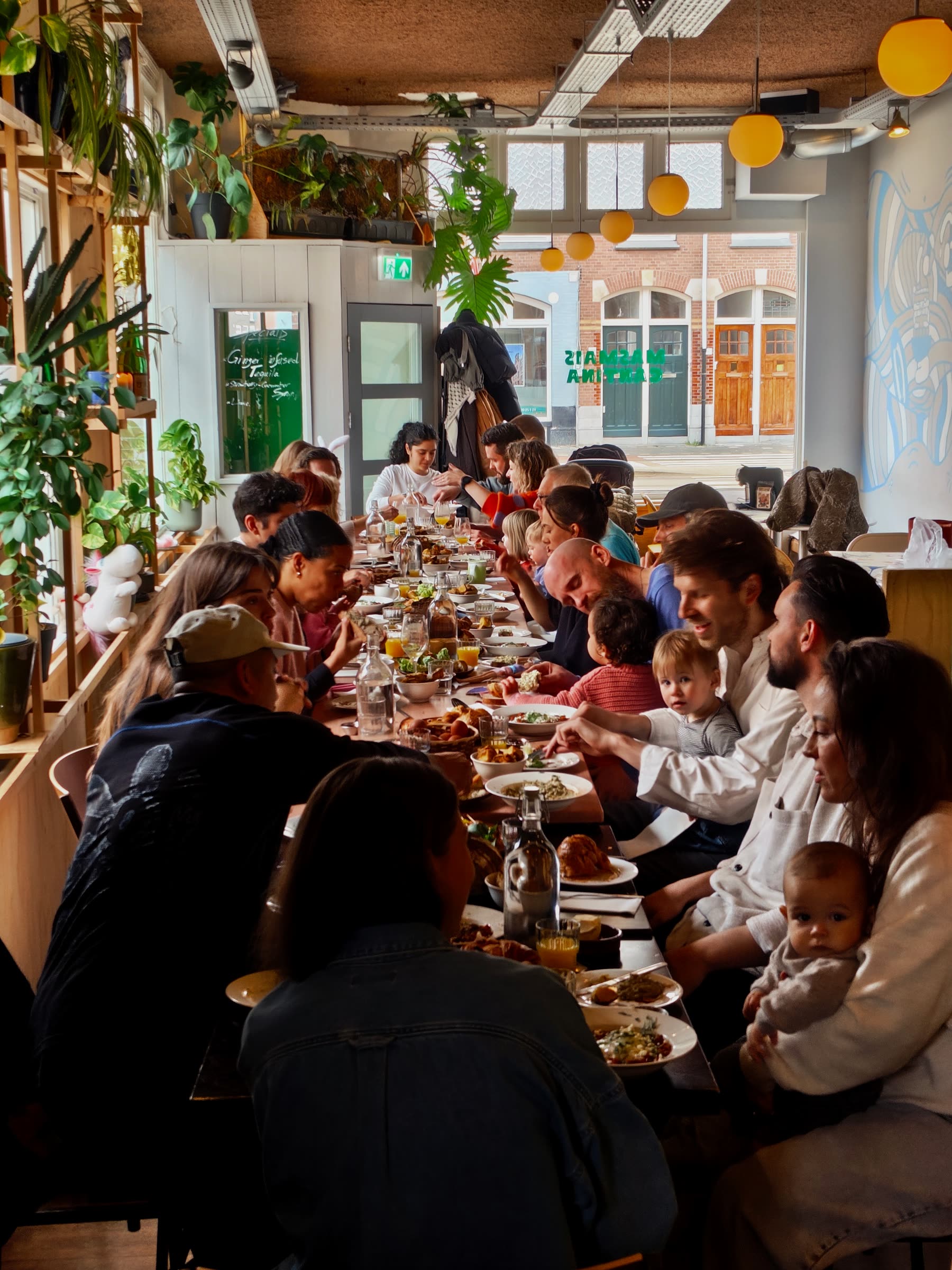 Guests sharing a long meal at the table